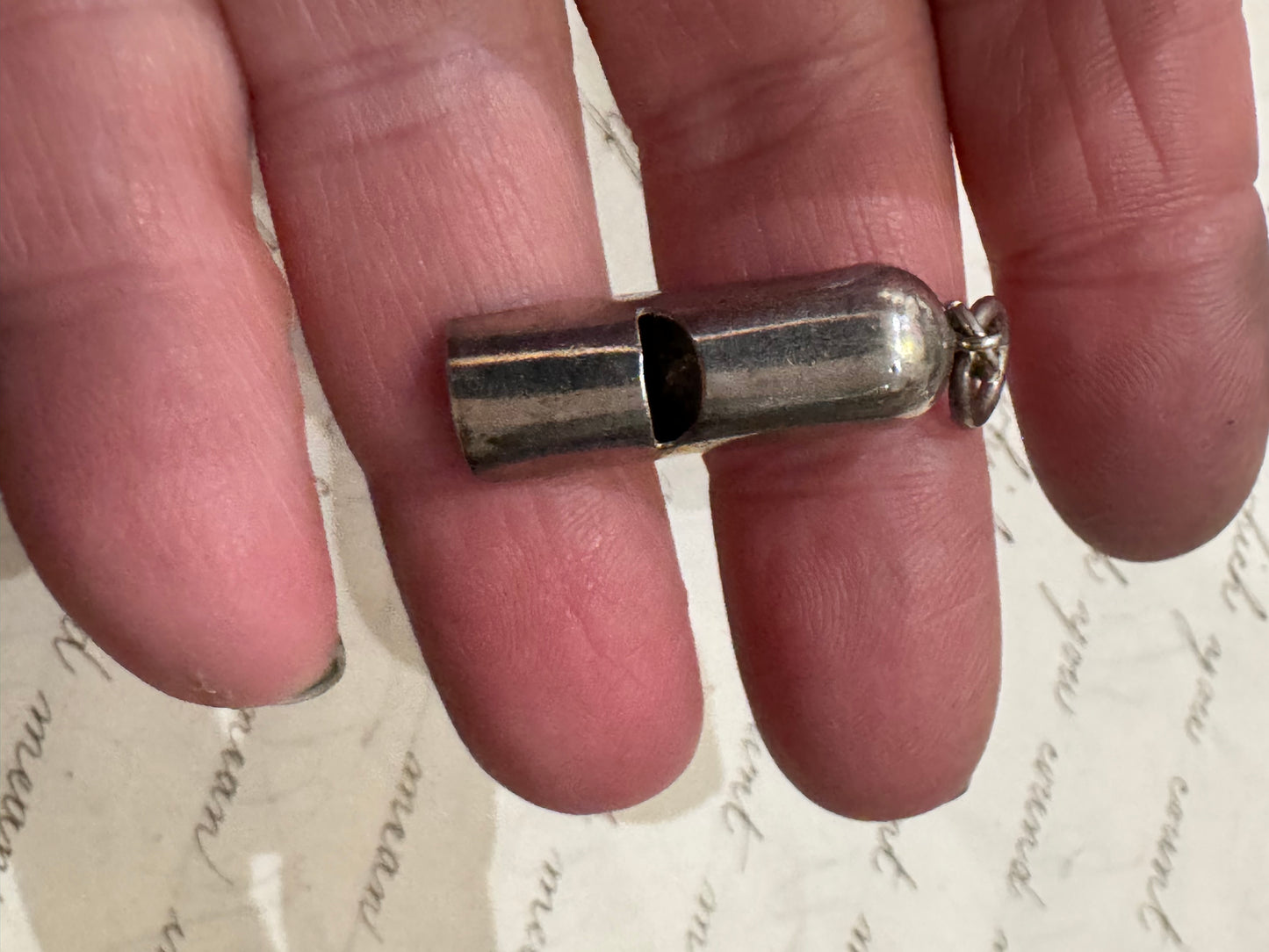 smaller, simple silver VERY LOUD whistle