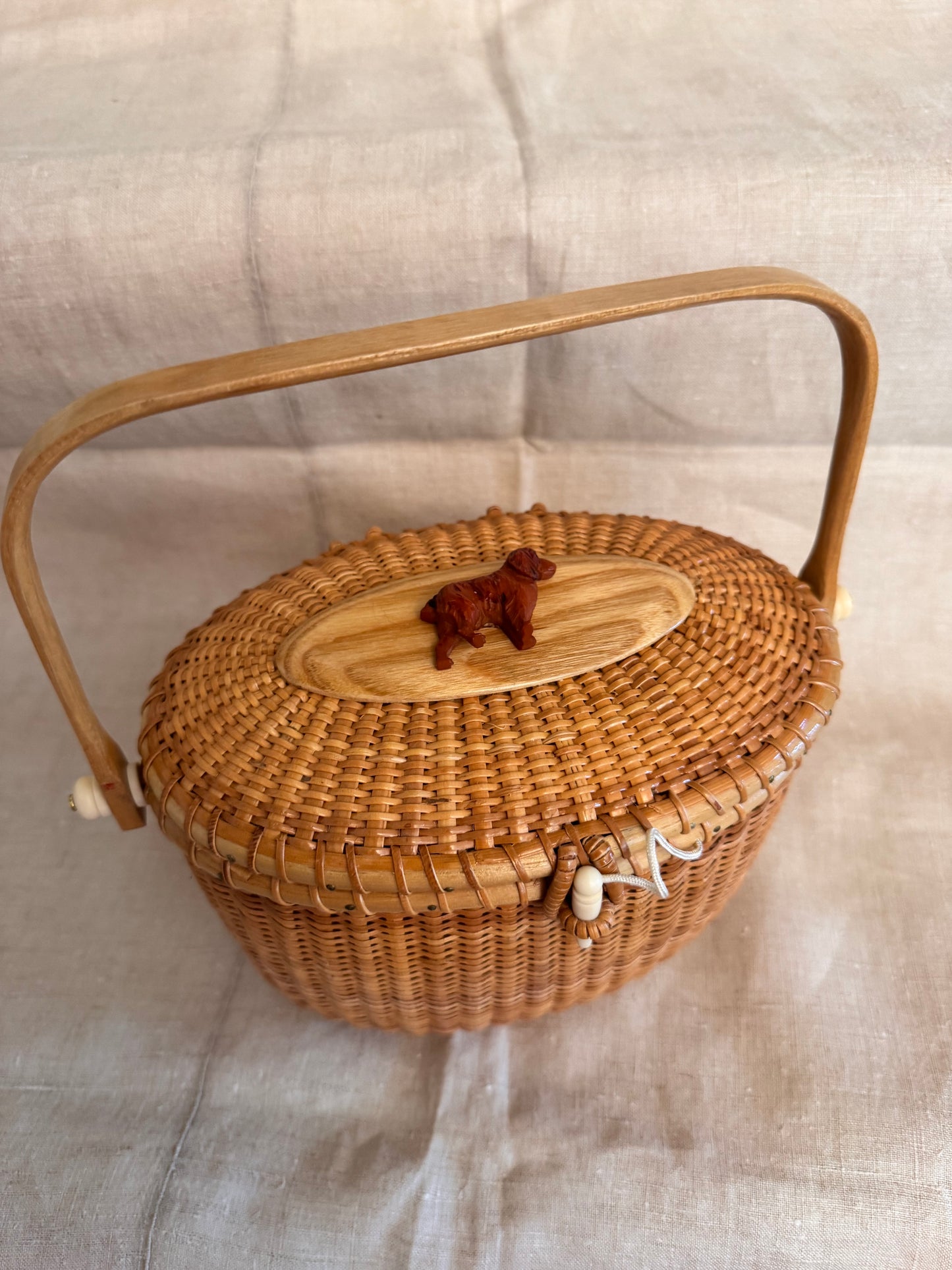 Large Oval Nantucket Basket with Carved Vintage Bakelite Dog