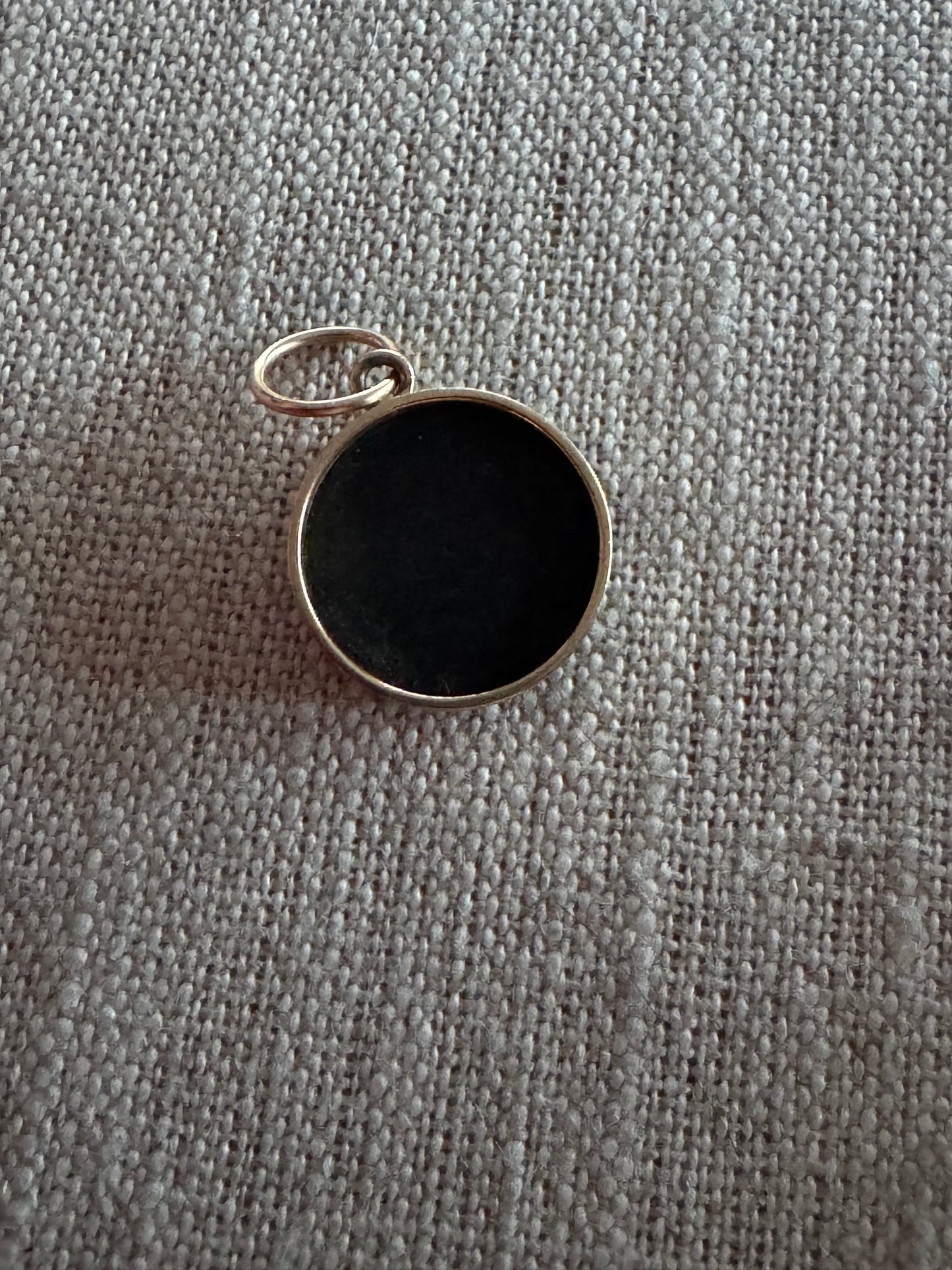 charming, black druzy smiley face pendant set in 14K bezel