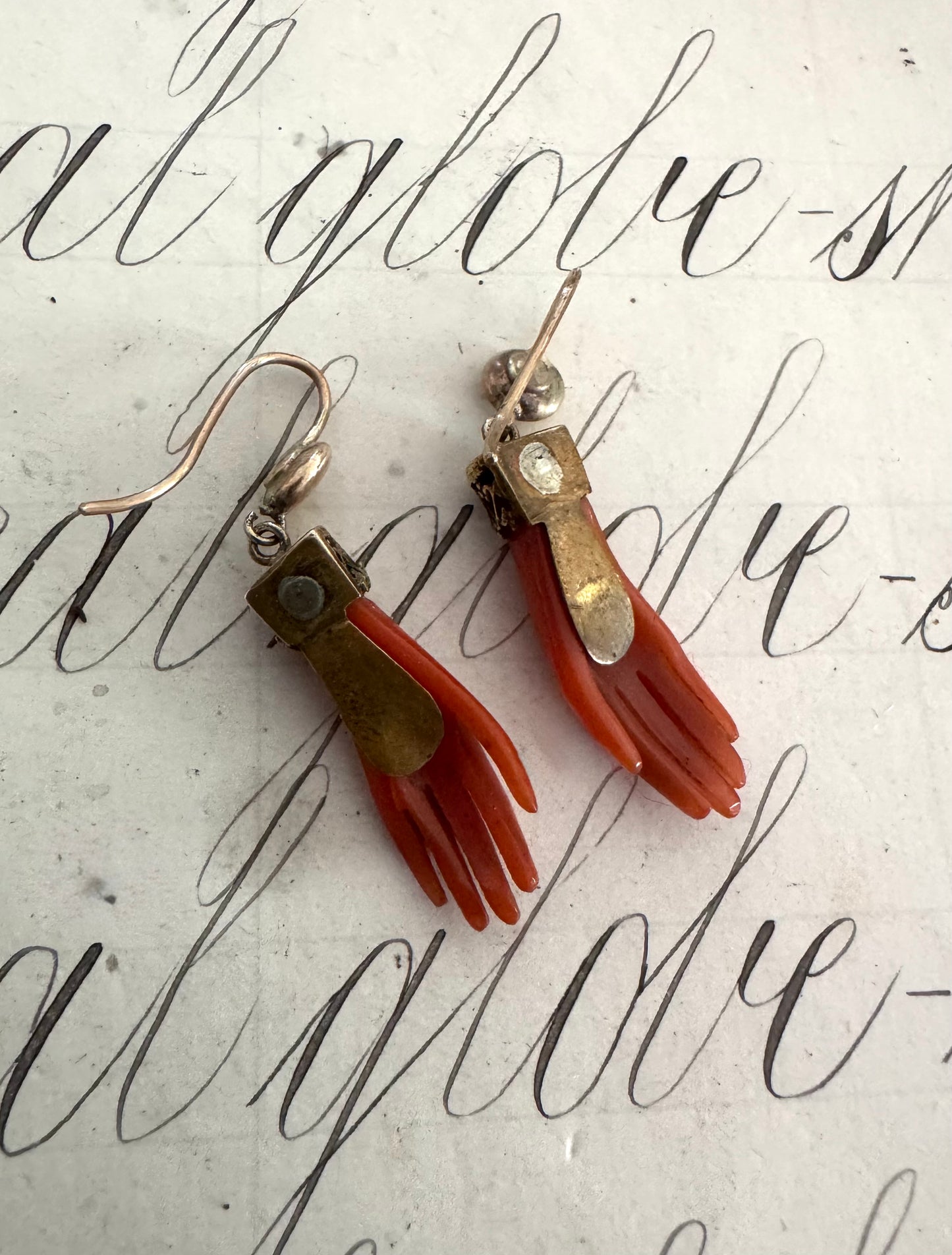 Rare pair of antique celluloid hand earrings