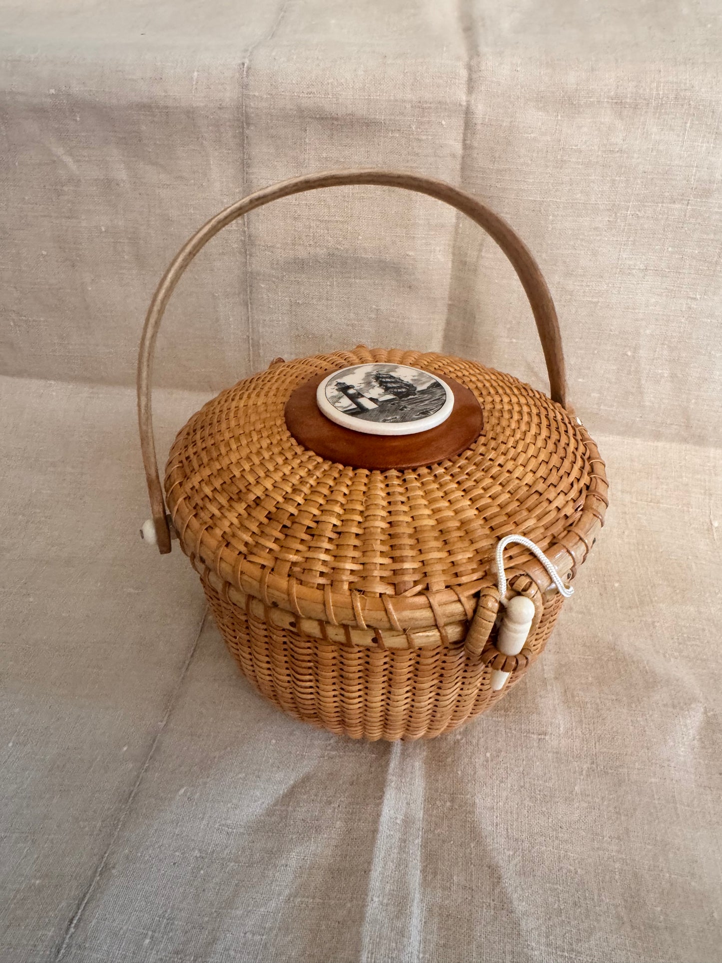 Medium Round Basket with Reproduction Scrimshaw Lighthouse and Schooner