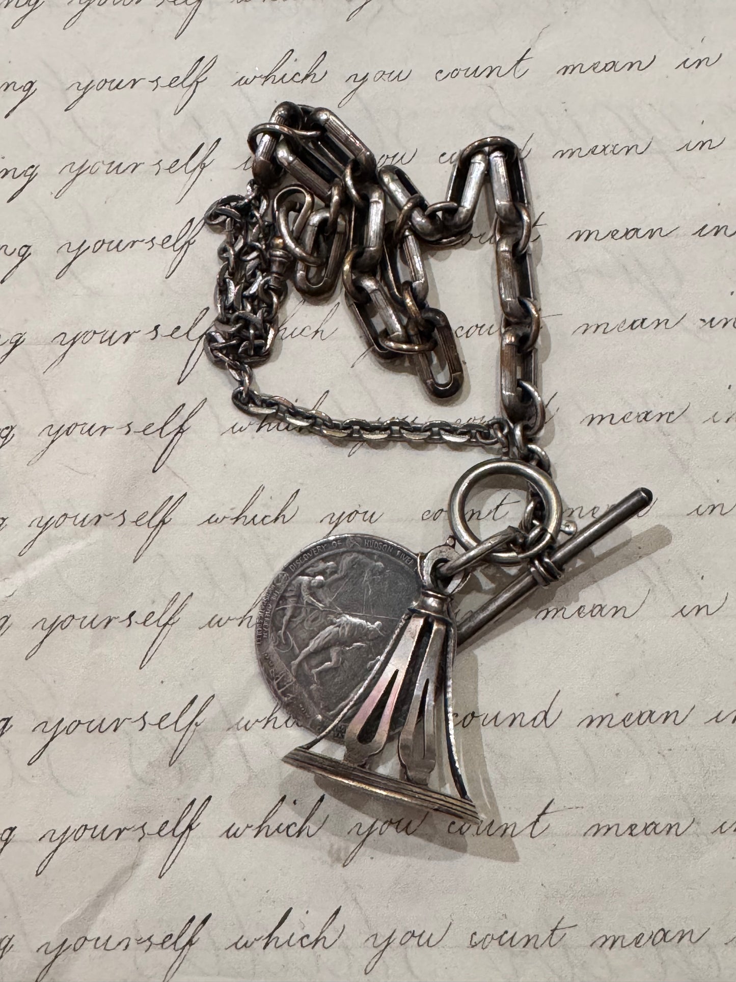 very old silver plated watch chain with fob and rare silver Henry Hudson medallion