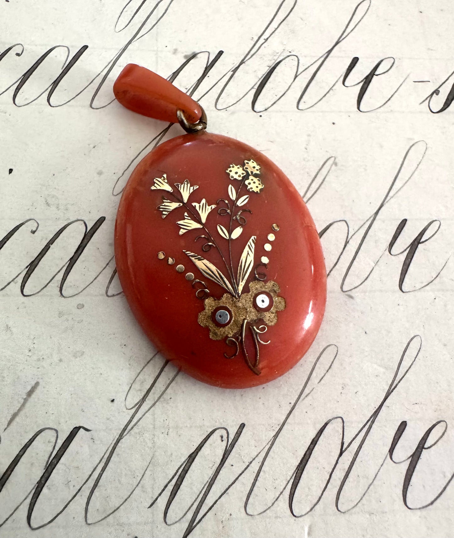 Beautiful antique celluloid locket with gold and silver inlay