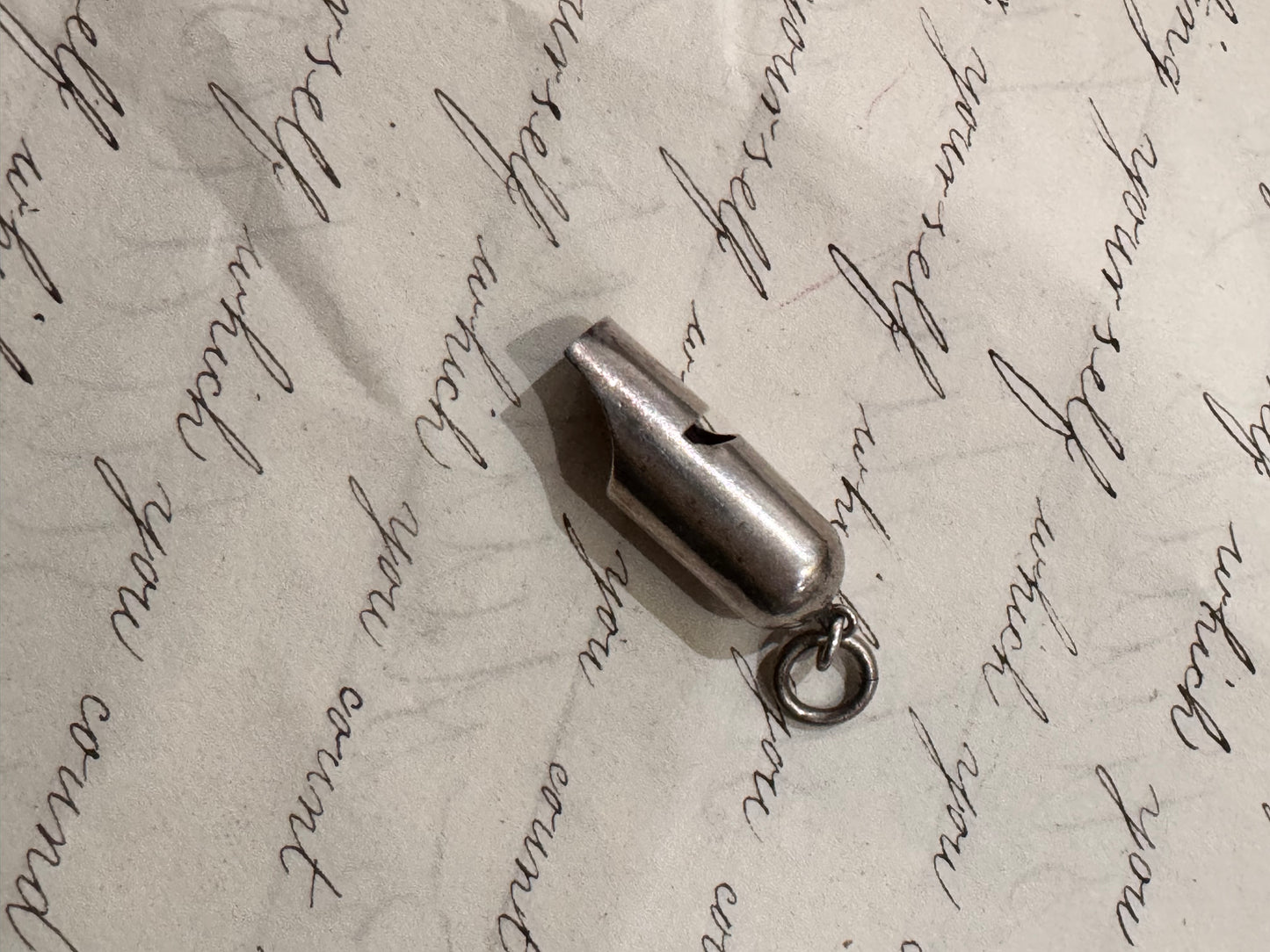 smaller, simple silver VERY LOUD whistle