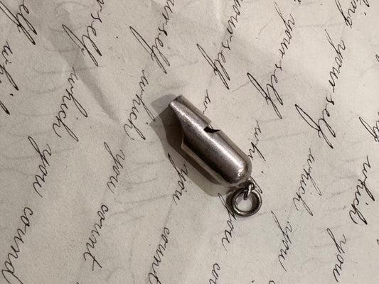 smaller, simple silver VERY LOUD whistle