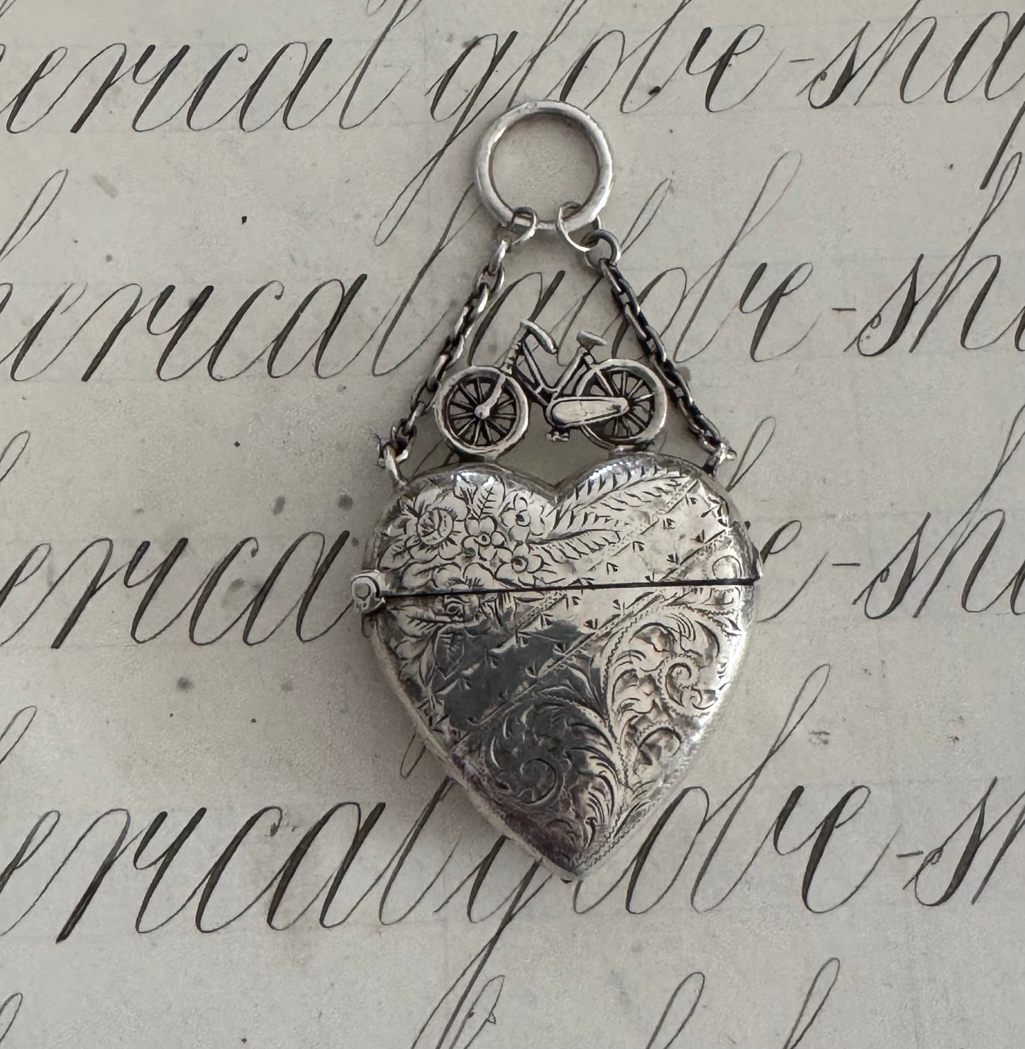 Incredible heart shaped match safe with bicycle