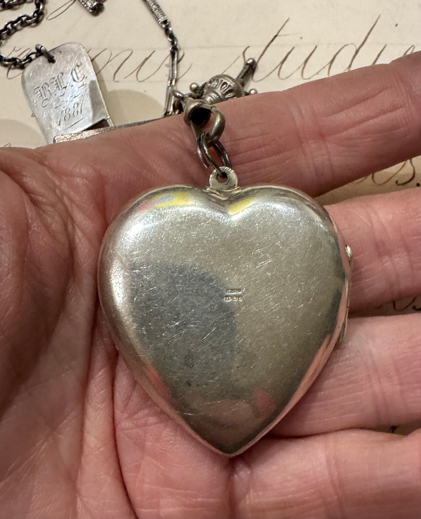 antique chain with large engraved heart locket and dated hanger with initials