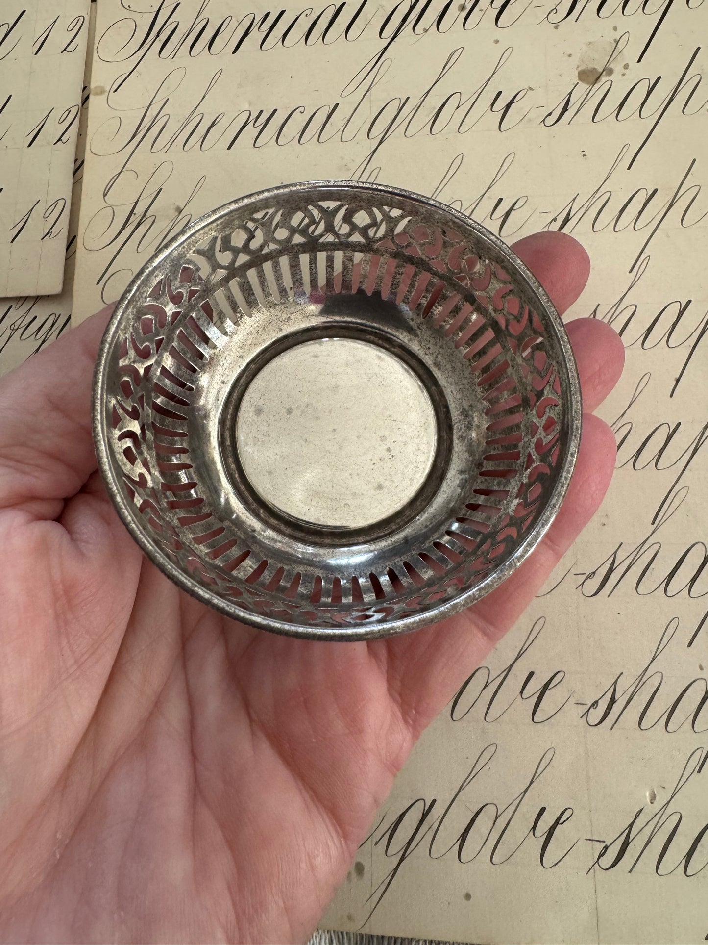 charming small round sterling pierced trinket dish