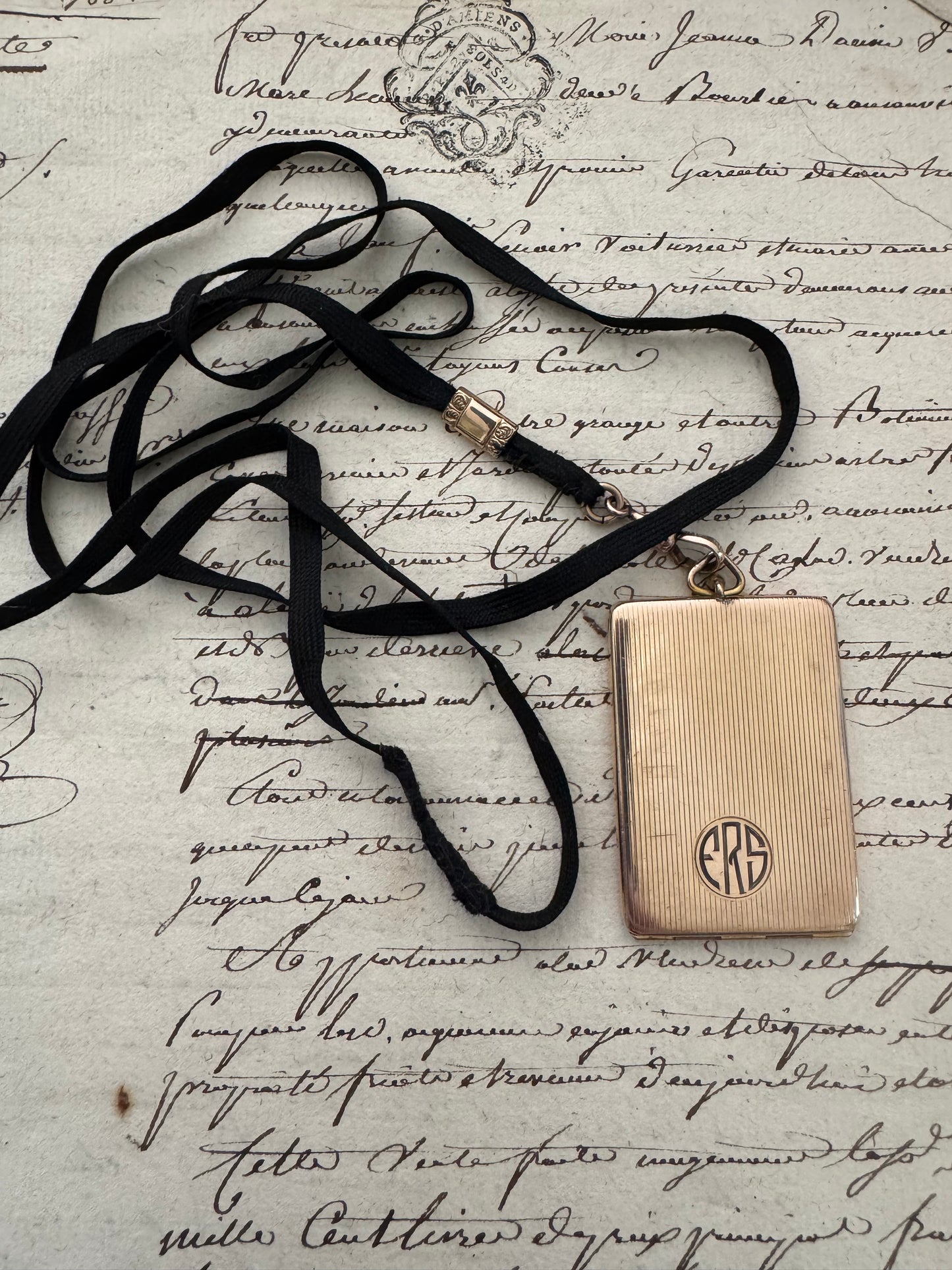 rectangular gold filled engraved Art Deco locket on original ribbon