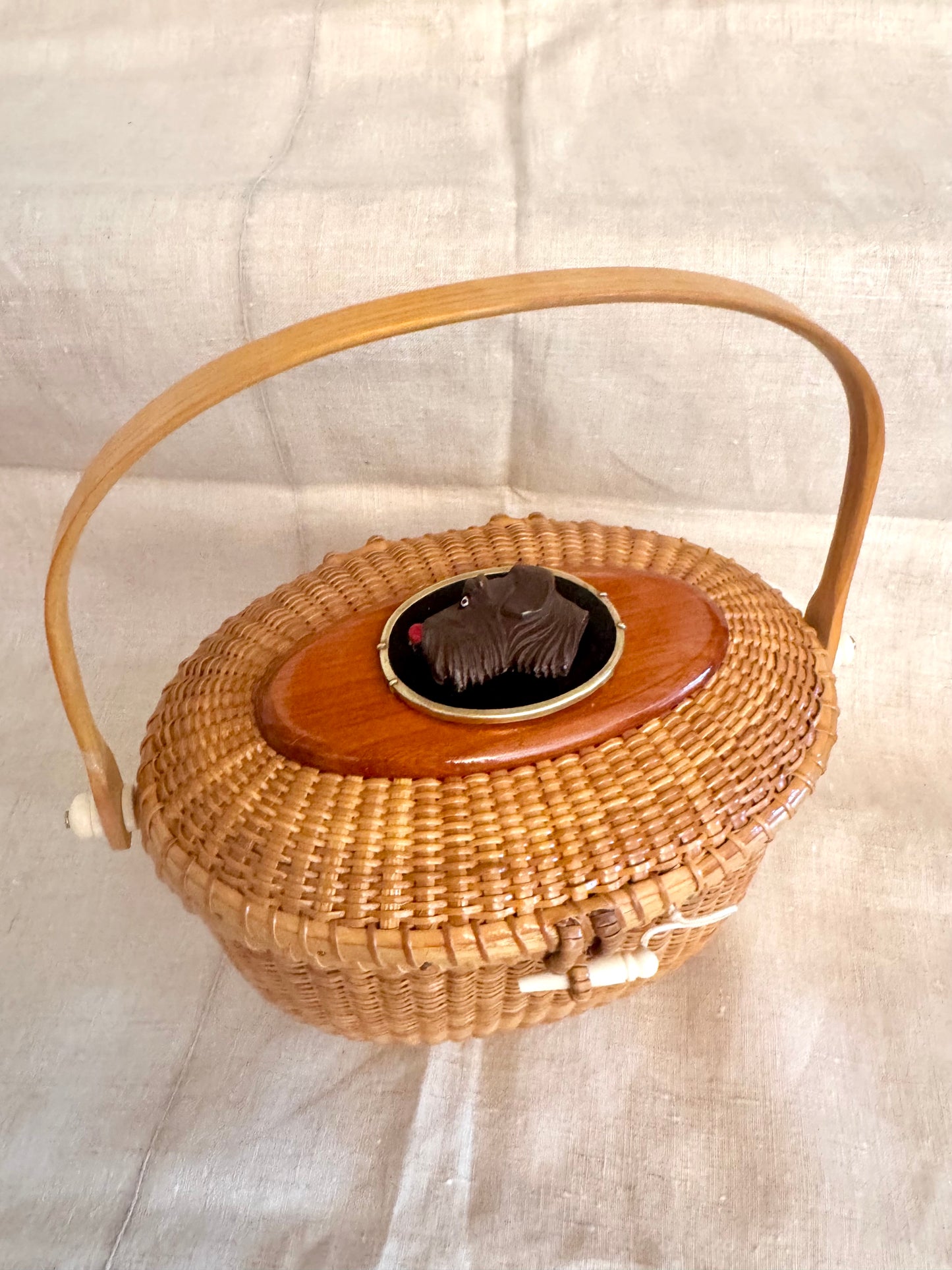 Large Oval Nantucket Basket with Carved Vintage Bakelite Dog in Brass Frame