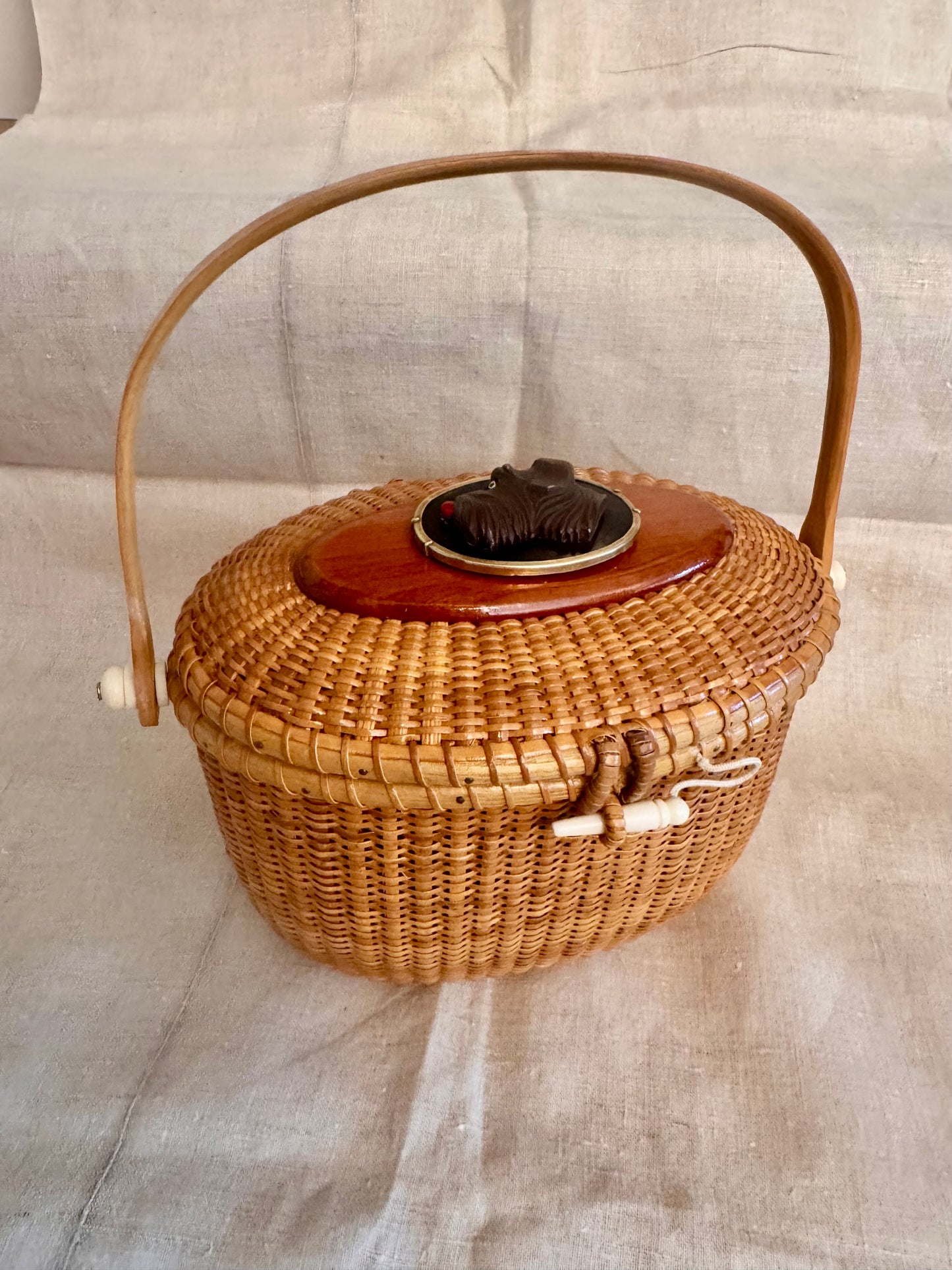 Large Oval Nantucket Basket with Carved Vintage Bakelite Dog in Brass Frame