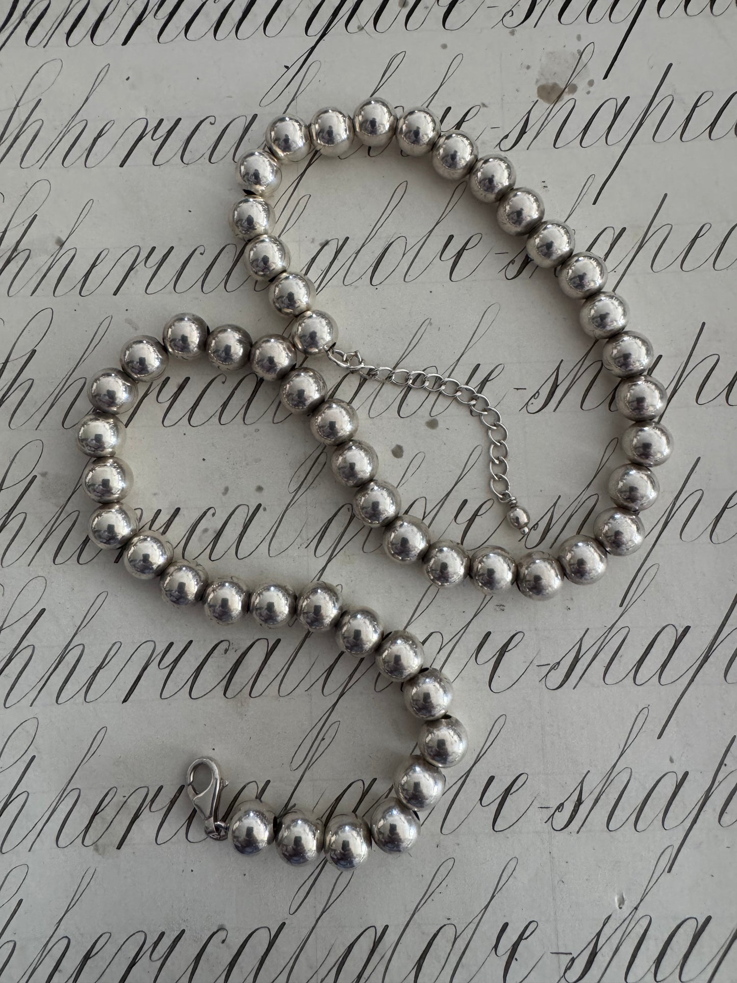 Heavy adjustable length silver bead necklace