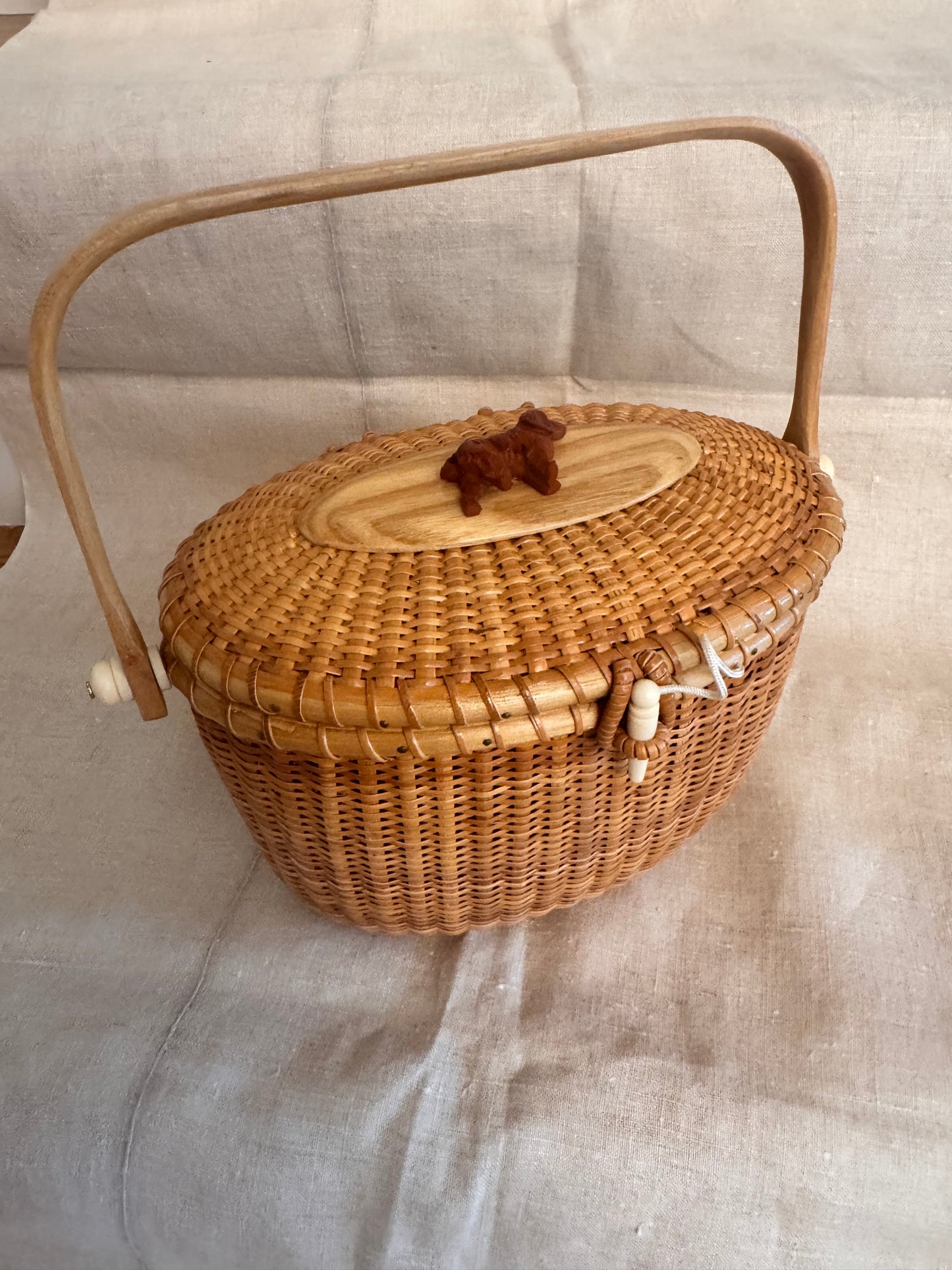 Large Oval Nantucket Basket with Carved Vintage Bakelite Dog