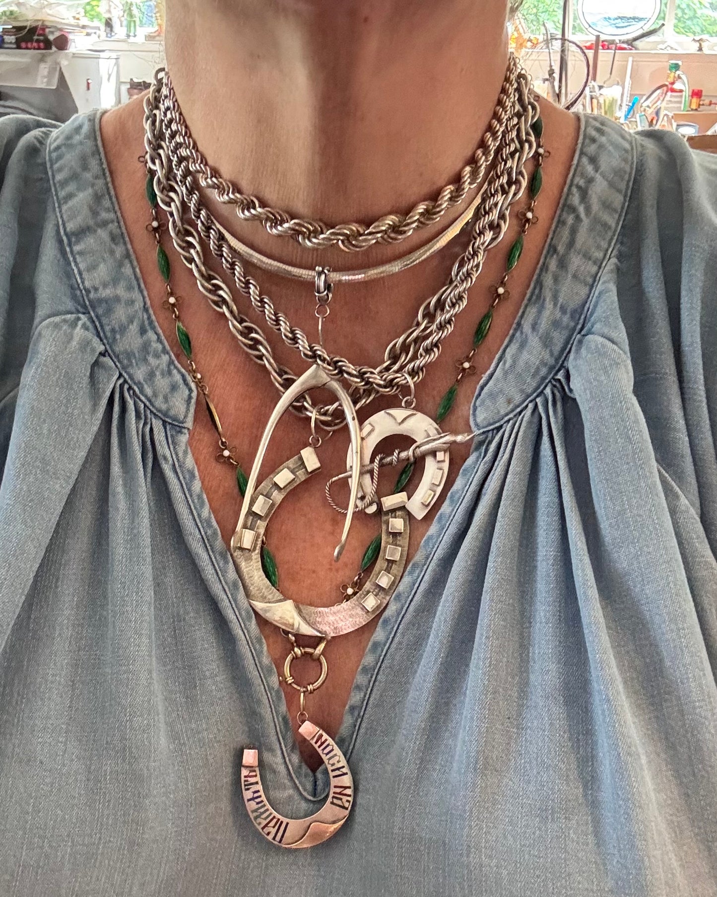 amazing horseshoe pendant with riding crop detail