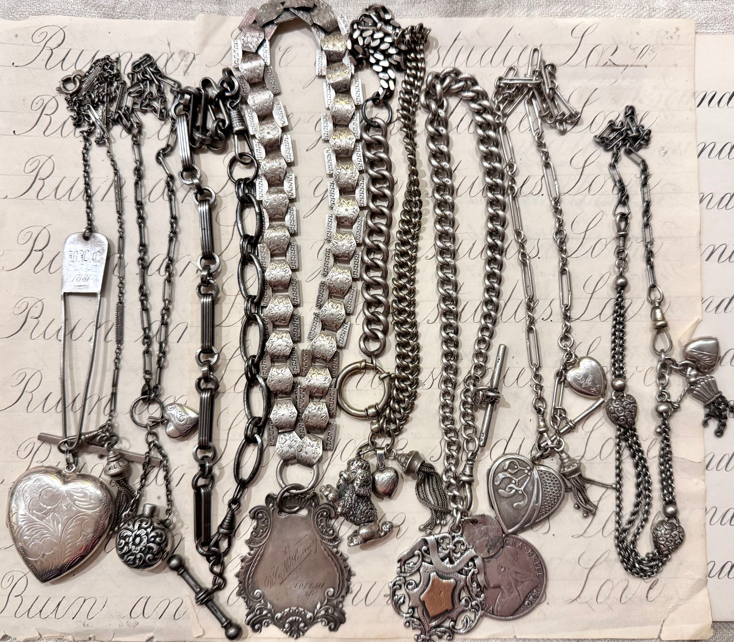 lovely English watch chain with two heart lockets and tassel