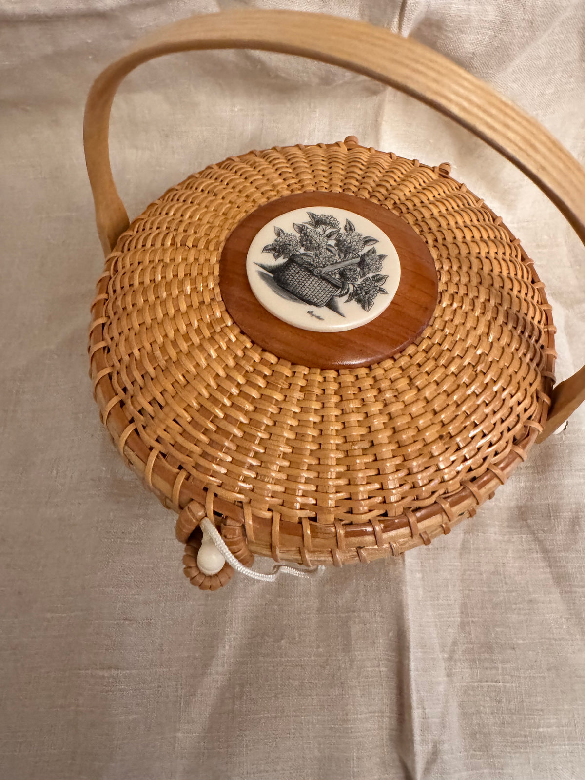 Medium Round Basket with Scrimshaw Nantucket Basket of Flowers