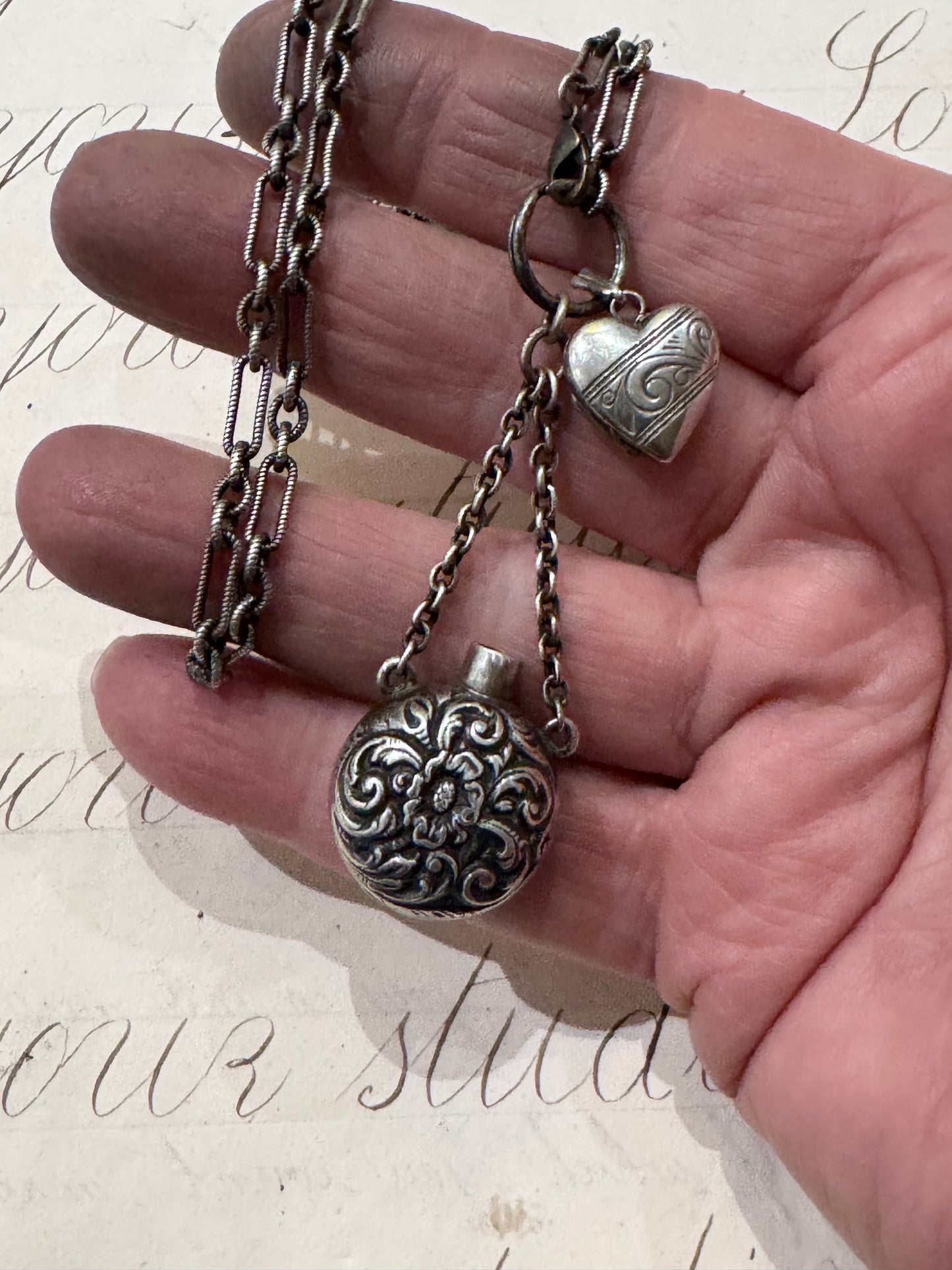 sweet Sterling silver chain with chased bottle and engraved miniature heart locket