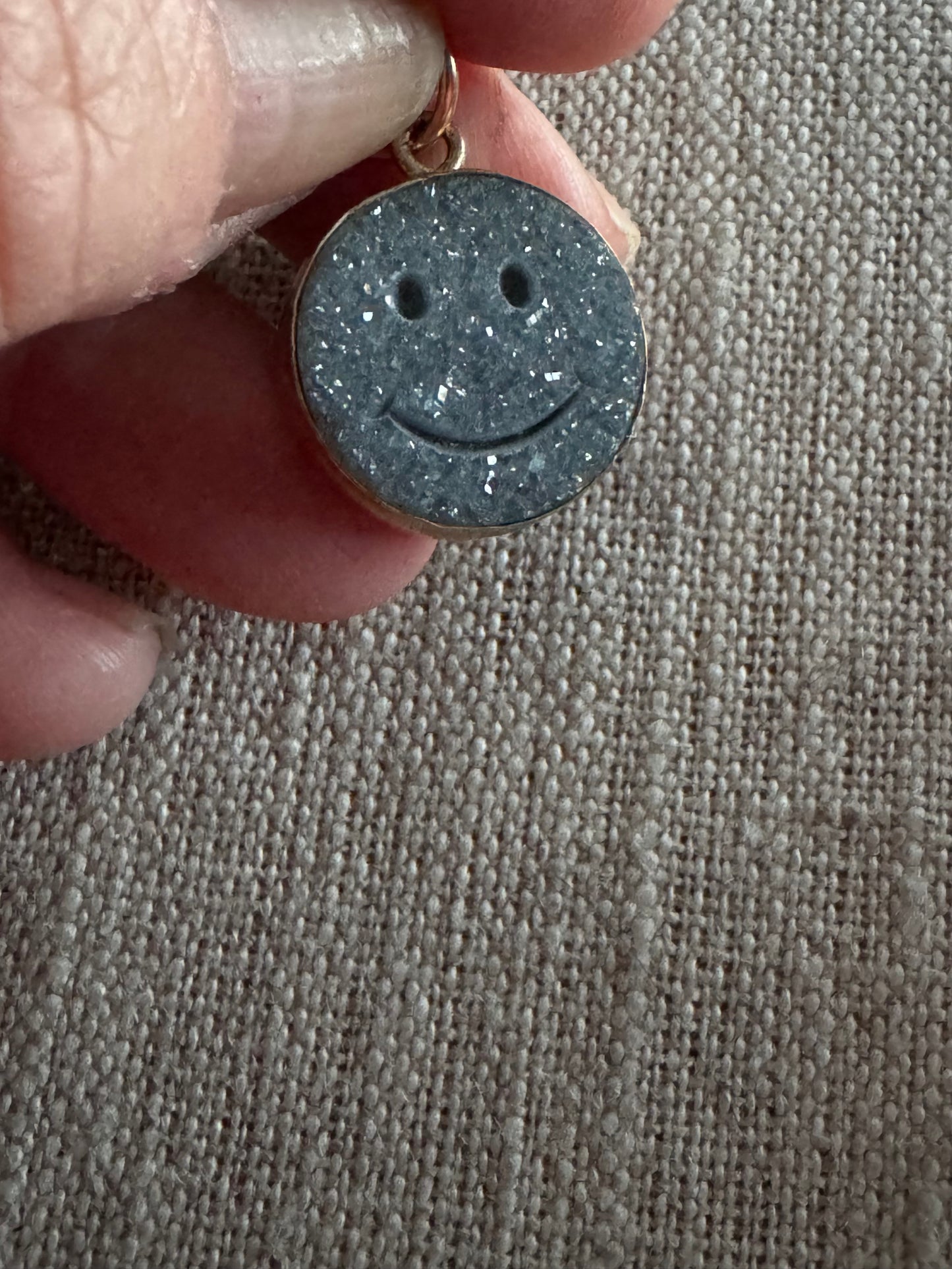 charming, black druzy smiley face pendant set in 14K bezel