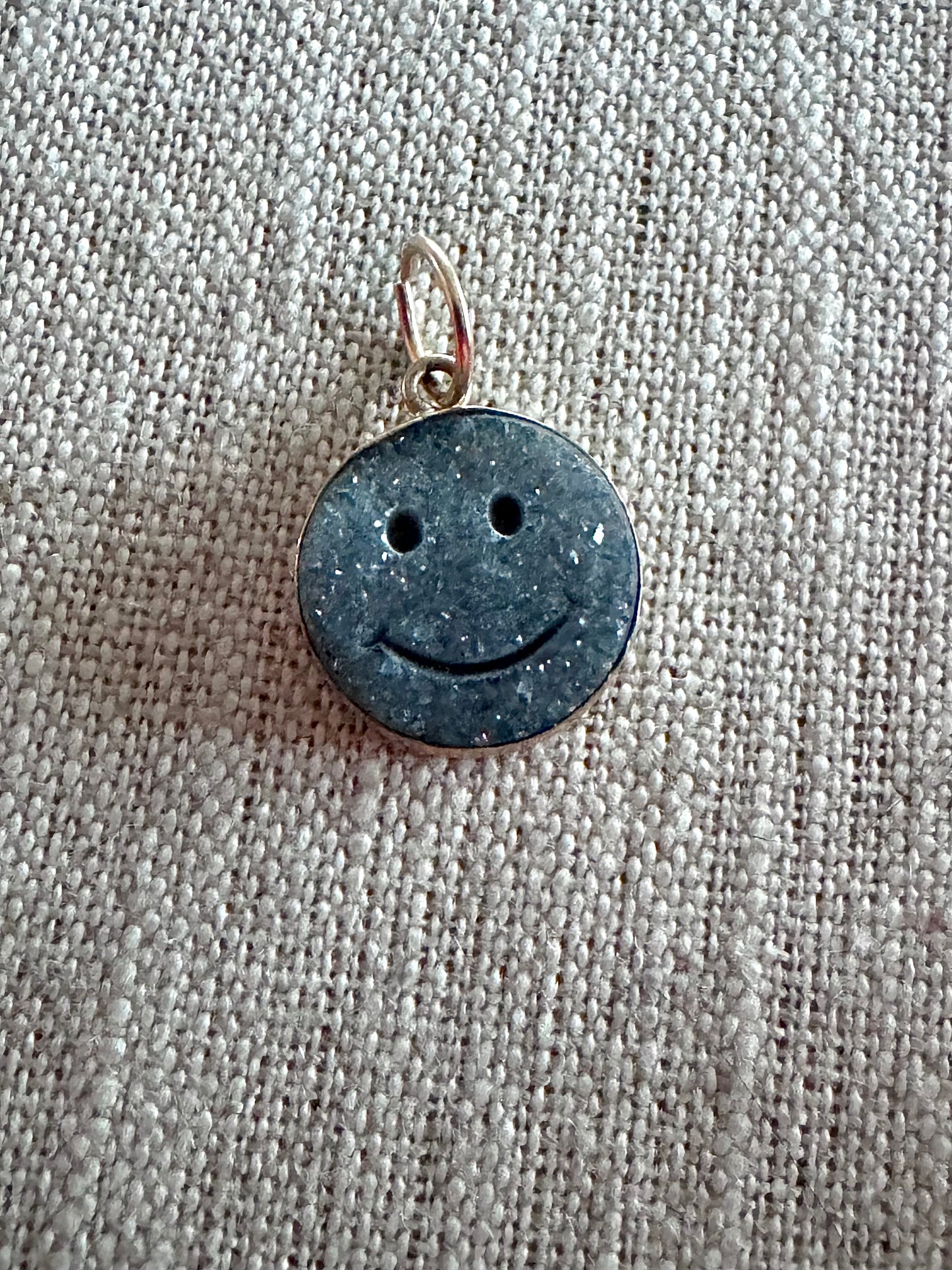 charming, black druzy smiley face pendant set in 14K bezel