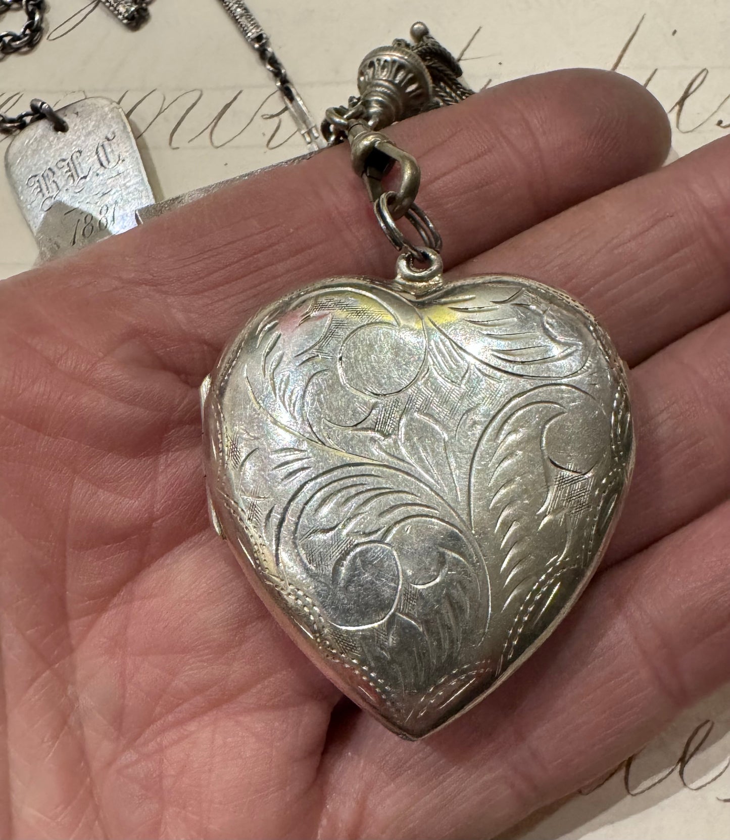 antique chain with large engraved heart locket and dated hanger with initials