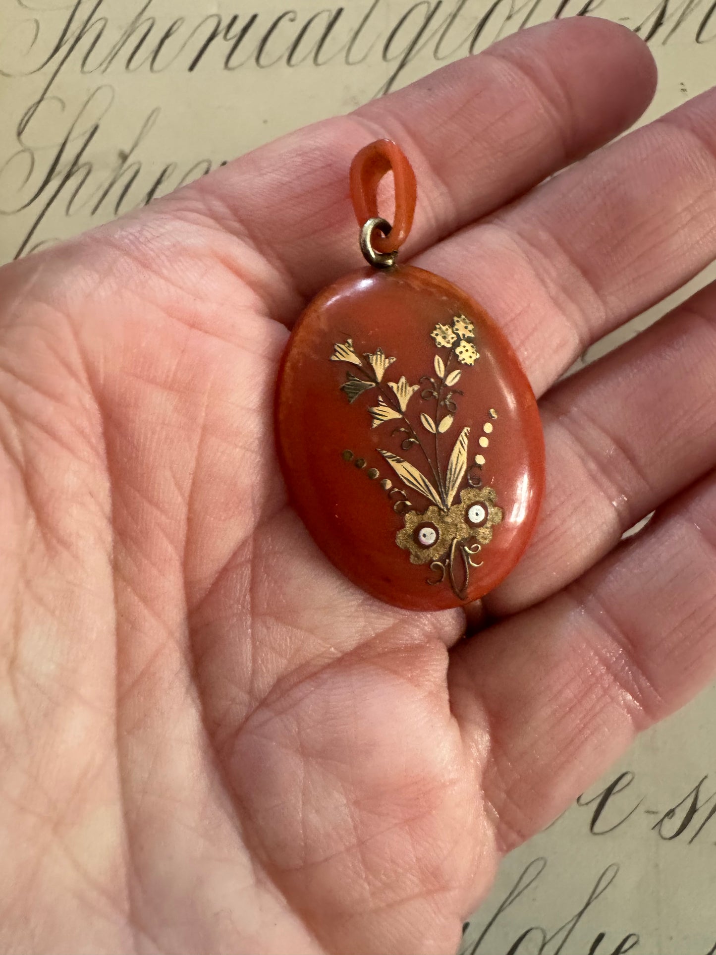 Beautiful antique celluloid locket with gold and silver inlay